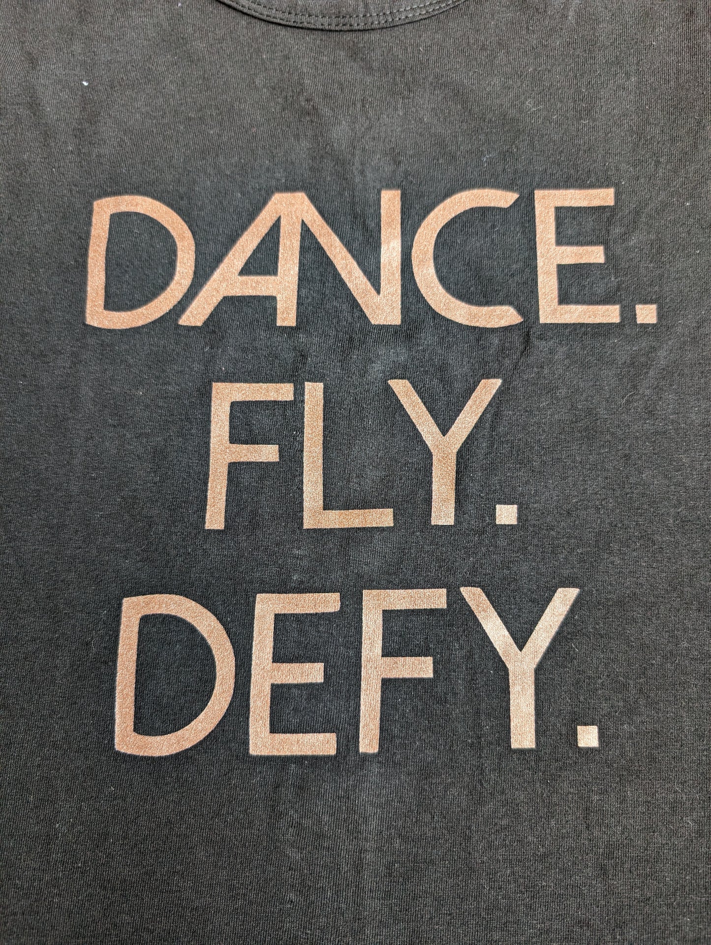 Dance. Fly. Defy Tank